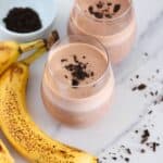 top view, 2 glasses of protein shakes with chocolate sprinkles on top.