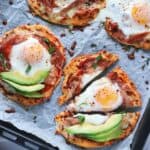 naan pizzas on baking sheet.
