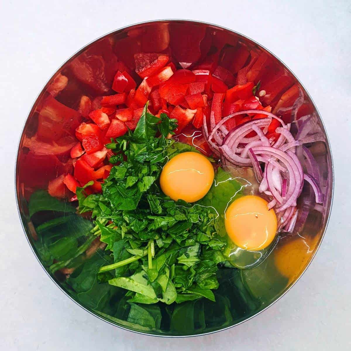 adding eggs and egg whotes.
