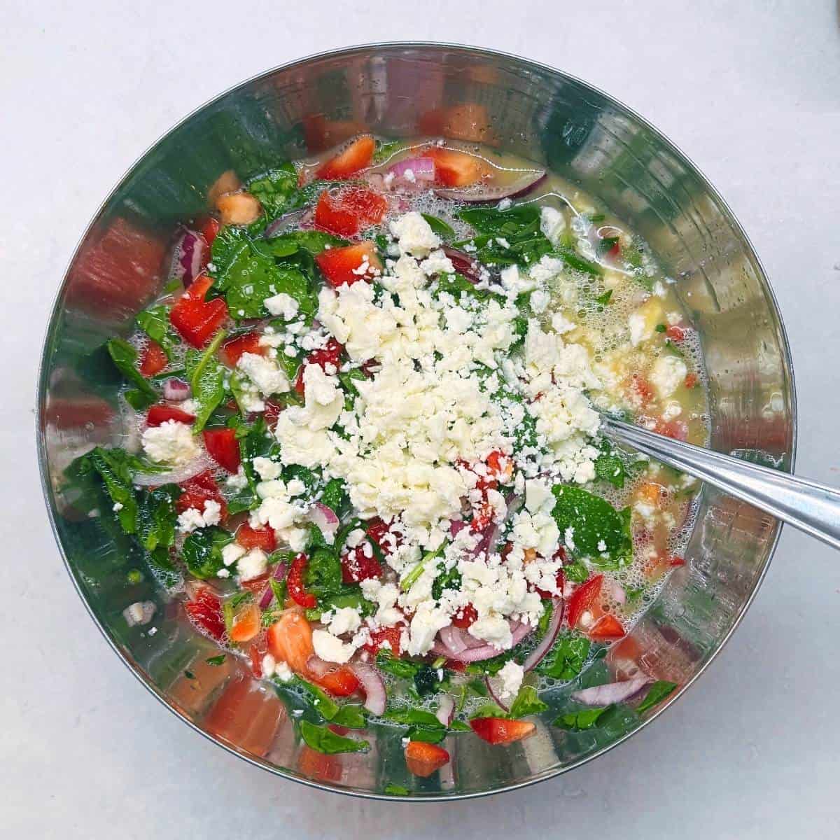 mixing in the feta cheese.
