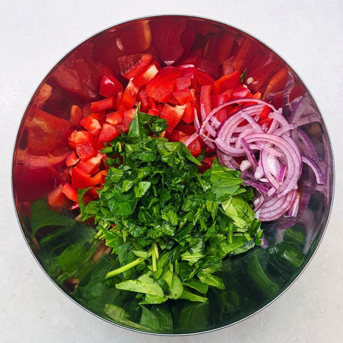 chopping the vegies into a bow.
